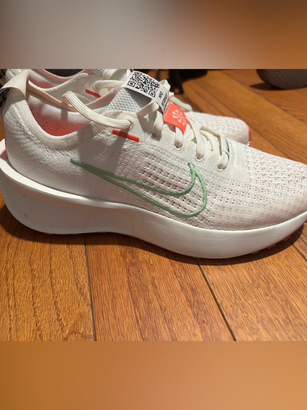 Nike White Woman’s Running Shoes with Mint Green Swoosh and Coral Accents